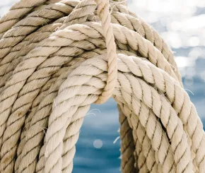Close up of looped ropes near the sea